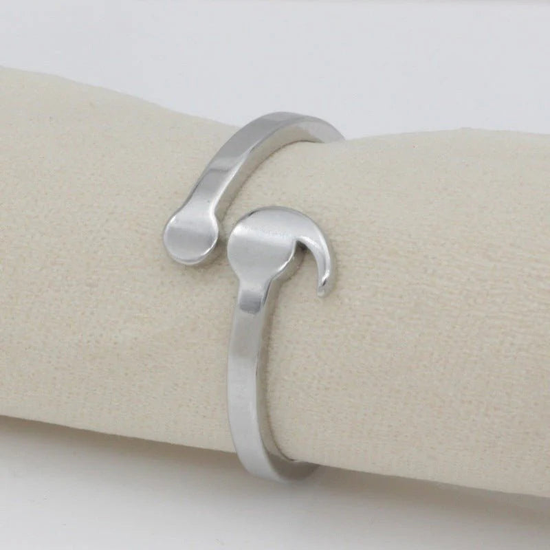 Elegant semicolon wave ring showcasing unique design, perfect for symbolic jewelry and stylish accessories.