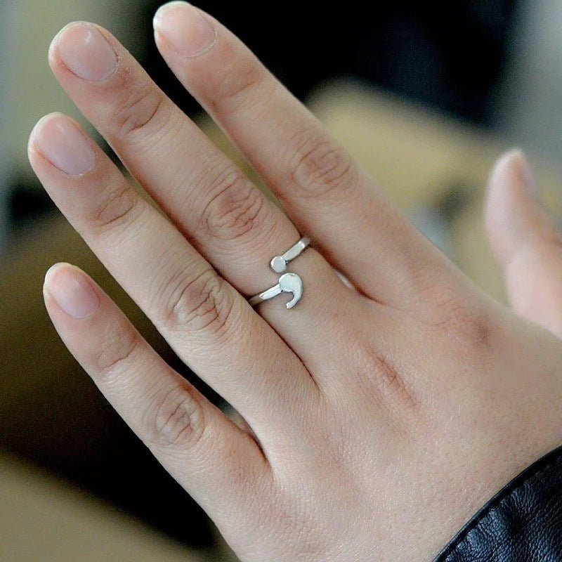 Elegant semicolon wave ring showcasing unique design, perfect for symbolic jewelry and stylish accessories.
