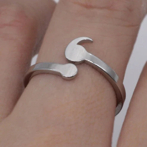 Elegant semicolon wave ring showcasing unique design, perfect for symbolic jewelry and stylish accessories.